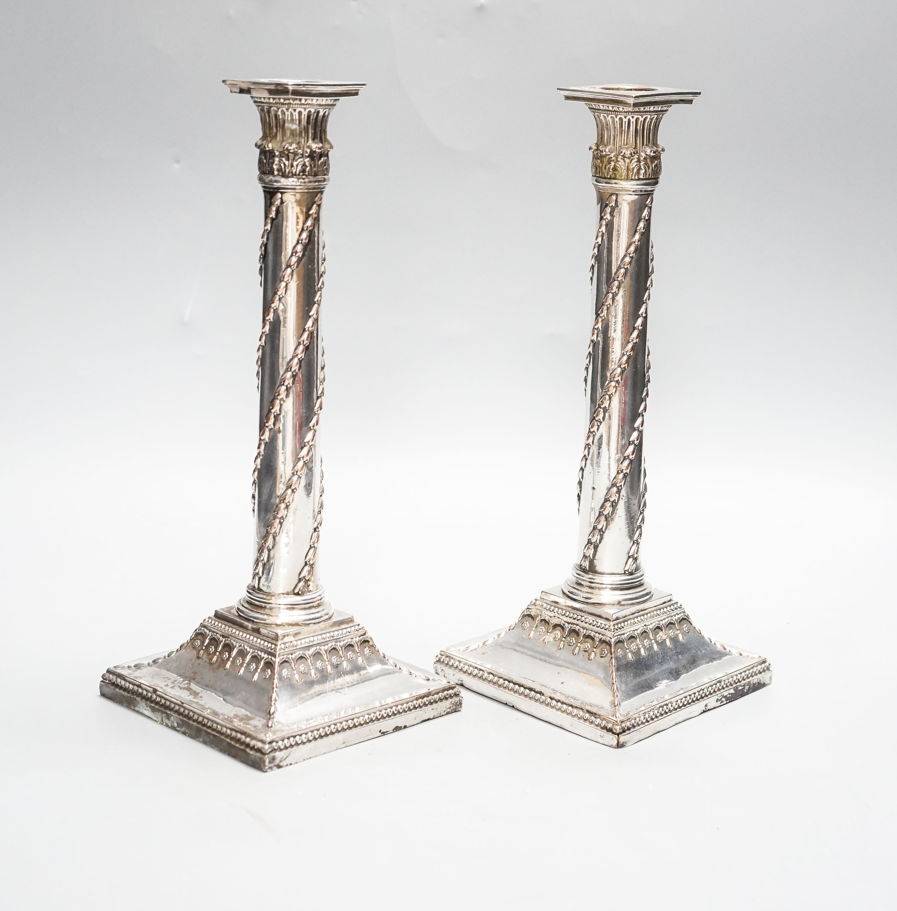 A pair of Victorian electroplate Corinthian column candlesticks, 28.5cm